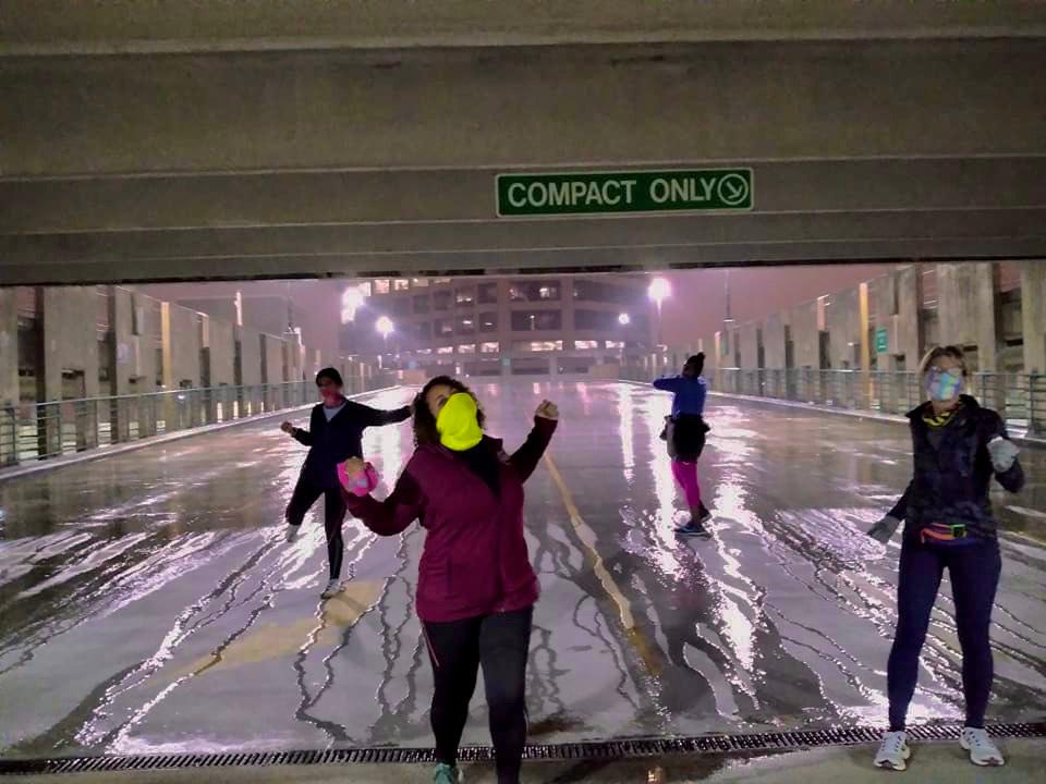 Yoga under an overpass in the rain